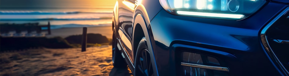 front view of blue car on coast