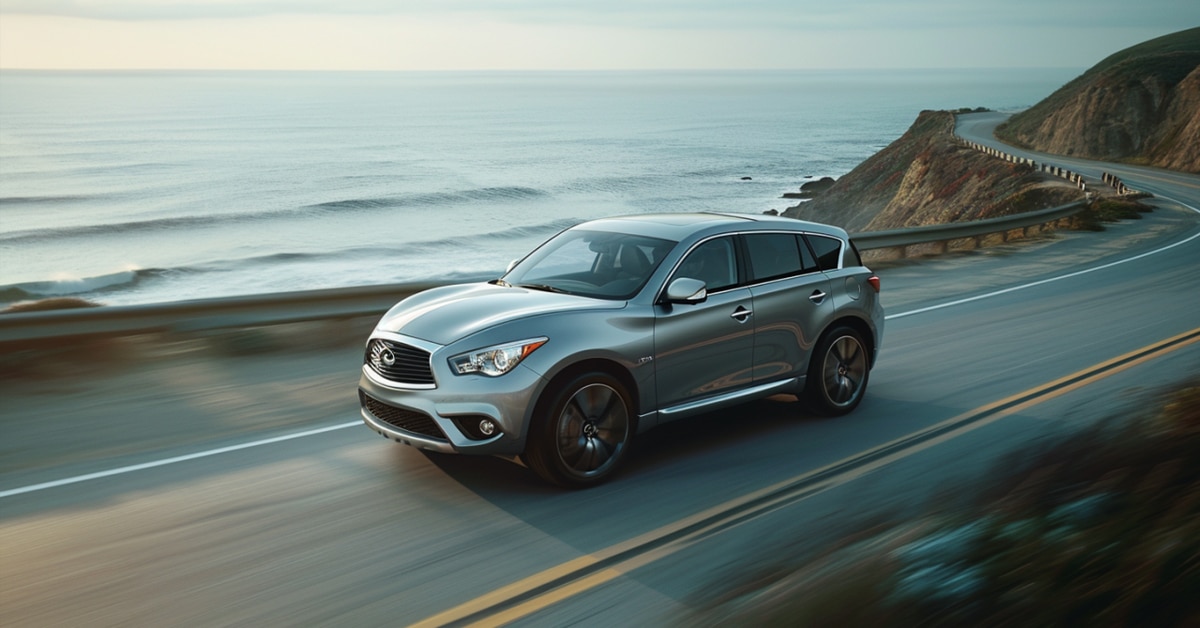 Infiniti QX70 driving up coastal highway