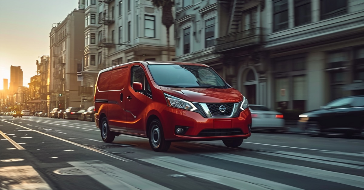 Nissan NV200 van making deliveries in the city at sunrise