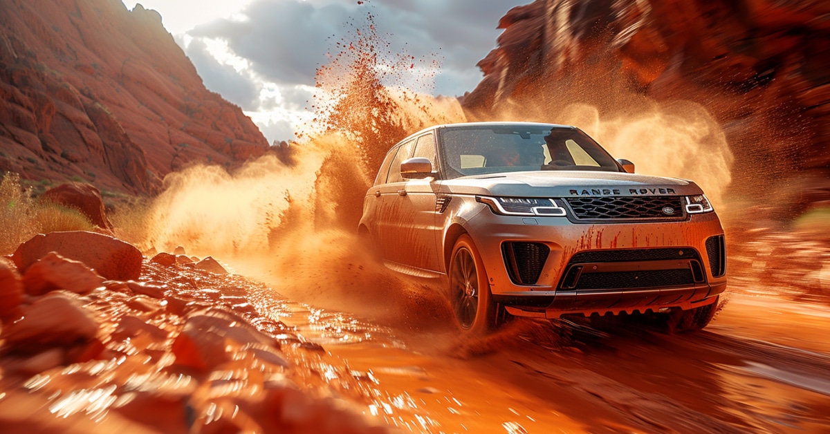 Range Rover Sport driving fast on a muddy mountain road